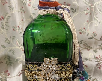 Repurposed bejeweled large green glass  bottle  with rhinestones