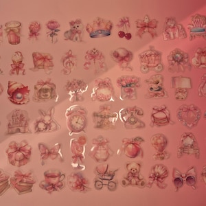 May include: A collection of small, pink-toned decorative stickers featuring various illustrations including bows, animals, flowers, sweets, clocks, and household items arranged in a grid pattern on a light pink background.