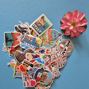 May include: A collection of colorful travel stickers featuring Italian landmarks and cities, including Rome and Milan, with a pink flower on a blue background. The stickers showcase various designs and illustrations.