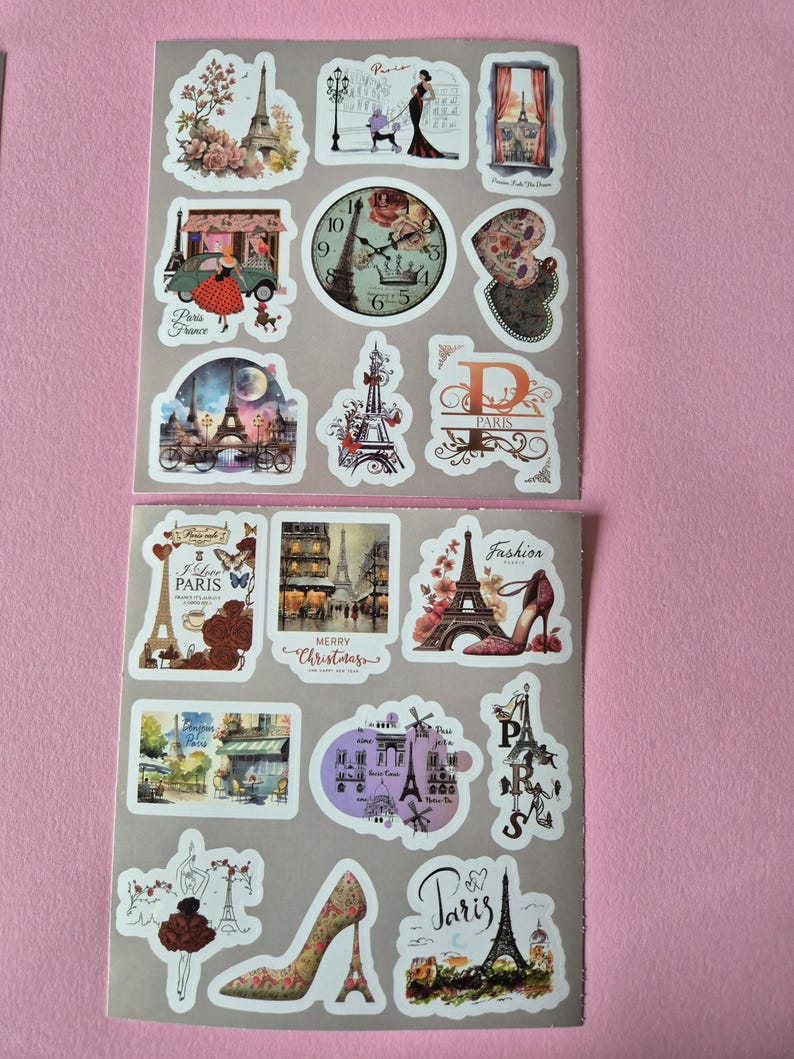 May include: Two sheets of stickers featuring Parisian themes. Designs include the Eiffel Tower, vintage cars, clocks, high heels, and illustrations of people. The stickers have a variety of colors, including pink, red, and brown.