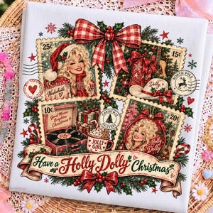 May include: A white fabric square featuring a Christmas-themed graphic with four postage stamp-style illustrations of Dolly Parton, a record player, and gifts. The text reads 'Have a Holly Dolly Christmas', 'Nashville', 'Good Music Brighter Christmas', 'Dolly', 'Jolly Girl', and 'Holly Dolly'.