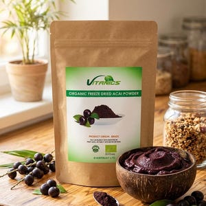 May include: A brown paper bag of organic freeze-dried acai powder with the brand name "Vitanics" and the text "Organic Freeze Dried Acai Powder". A bowl of acai, a spoon with acai powder, and fresh acai berries are also visible.