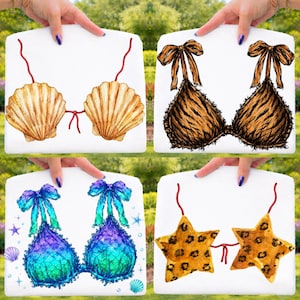 May include: Four watercolor bikini top designs. One features seashell cups with red string ties. Another has a tiger stripe pattern with brown bows. A third has a mermaid scale design with blue bows. The last has star-shaped cups with a leopard print.