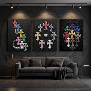 May include: Three rectangular wall art canvases featuring raised, colourful cross motifs on a black background. The left canvas shows crosses linked by a silver chain. The centre canvas displays a circular arrangement of crosses with a central heart.
