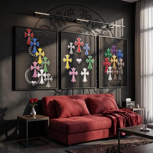 May include: Three framed wall art prints featuring colourful cross motifs arranged in various patterns against a dark background. The artwork displays red, blue, yellow, green, pink, and white crosses, some linked by silver chains and heart shapes.