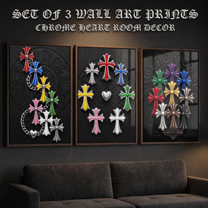 May include: A set of three wall art prints titled SET OF 3 WALL ART PRINTS CHROME HEART ROOM DECOR. Each print features a black background with embossed circular patterns and various colourful cross-shaped emblems in red, blue, yellow, green, pink, and silver.