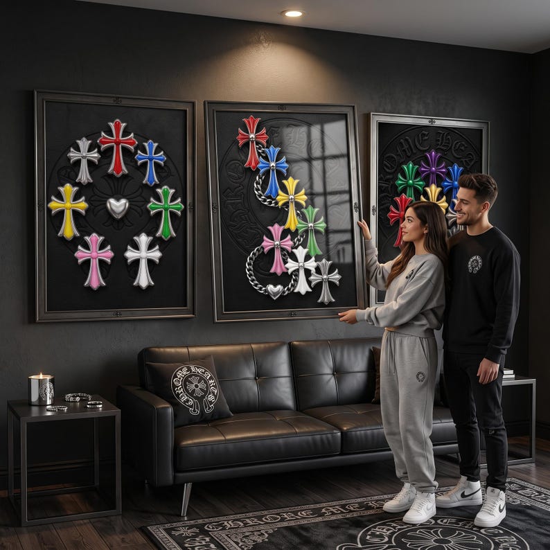 May include: Three framed wall art pieces featuring multi-coloured cross emblems arranged in circular and cascading patterns. The artwork displays red, blue, yellow, green, pink, white, and silver crosses against a dark background with metallic chain accents.