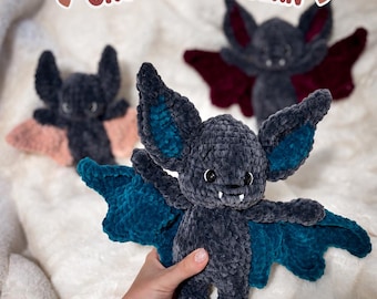 May include: Three plush bat toys made of dark gray velvet yarn with large ears and wings in teal, pink, and deep red. The bats have black safety eyes and two small white fangs. Text at the top reads Elliot, the Bat CROCHET PATTERN.