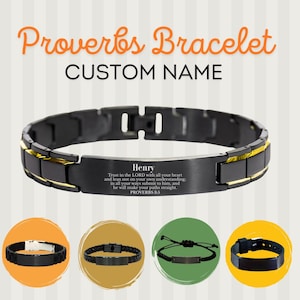 May include: A black and gold link bracelet featuring a central plate engraved with the name Henry and the text of Proverbs 3:5. The image also displays four smaller circular thumbnails showing various black bracelet styles with different designs.