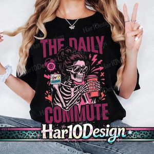May include: Black t-shirt with a graphic of a skeleton wearing sunglasses and holding a coffee cup. The text "THE DAILY COMMUTE" is above and below the skeleton. The brand name "Har10Design" is at the bottom.