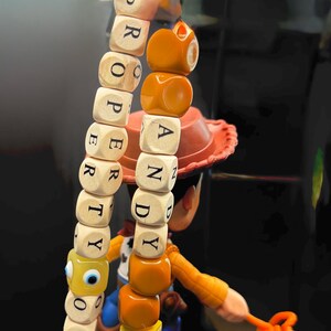 May include: A set of three ceramic mugs with a speckled, matte finish in cream, light grey, and dark grey. Each mug has a simple, minimalist design and a rounded handle.