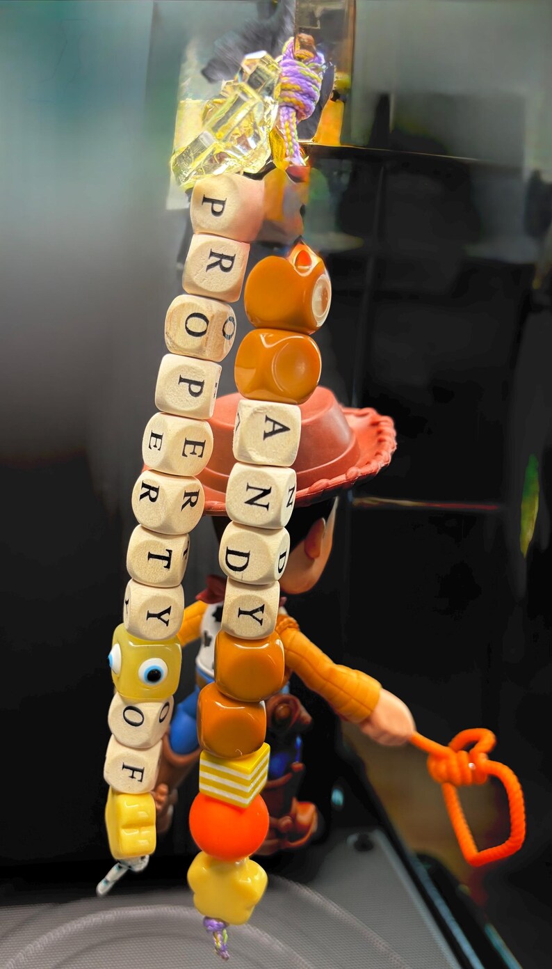 May include: A set of three ceramic mugs with a speckled, matte finish in cream, light grey, and dark grey. Each mug has a simple, minimalist design and a rounded handle.