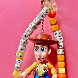 Sheriff Woody Bag Charm: Interactive Toy Story Keychain with Twirling Lasso image 5