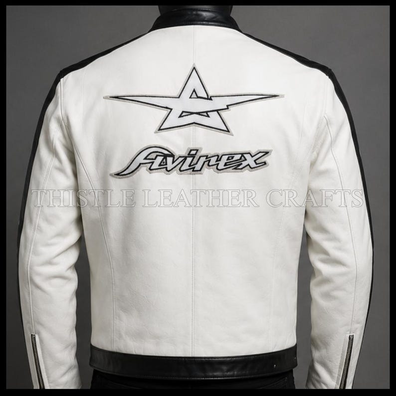 May include: White leather jacket with black accents on the shoulders, collar, and hem. The back features a star logo and the word "Avirex" in black, along with the text "Thistle Leather Crafts".