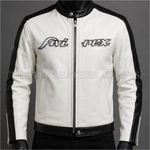 May include: White leather jacket with black accents on the shoulders and sleeves. The jacket has a stand-up collar, a full-length zipper, and the text "Fivi Rex" embroidered on the chest. The text "Thistle Leather Crafts" is printed at the bottom.