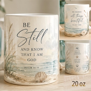 May include: A white ceramic mug with a 20 oz capacity, featuring watercolor beach illustrations of sand, sea, and shells. The text reads 'BE STILL AND KNOW THAT I AM GOD PSALM 46:10', 'HE MAKES all things beautiful IN HIS TIME', and 'LET GO', 'LET GOD', 'LET FAITH'.