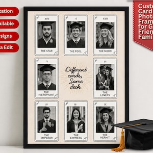 May include: A framed print with graduation photos styled as tarot cards. The cards display images of graduates with titles such as "The Star" and "The Fool." The text "Different cards, Same deck" is in the center. A graduation cap is in the foreground.