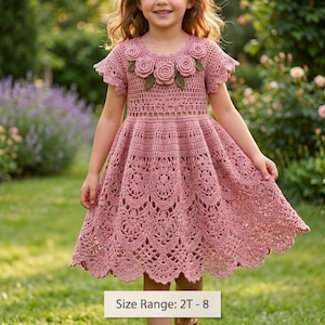 May include: A dusty rose crochet dress featuring short sleeves, a round neckline adorned with five three-dimensional crocheted roses with green leaves, and a flared skirt with an intricate lace pattern. The text Size Range: 2T - 8 is visible.