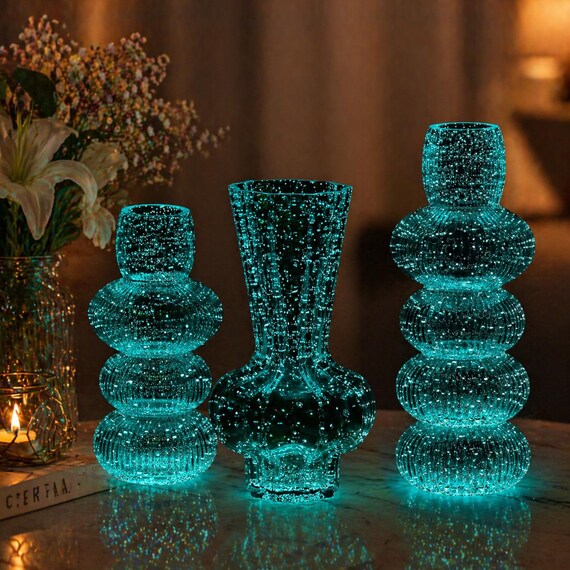 A hand-blown gourd vase that glows in the dark — gorgeous by day, eerie and magical by night.