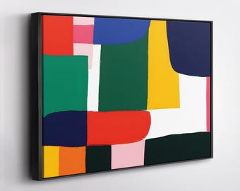 May include: A rectangular wall art piece featuring an abstract composition of bold, solid color blocks in red, green, blue, yellow, pink, orange, and black, separated by white negative space, all enclosed within a thin black frame.