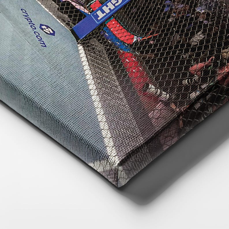 May include: A rectangular canvas print featuring a sports scene behind a black mesh net. The image includes a blue banner with the text "crypto.com" and a partial view of a red and white surface. The canvas has a textured fabric finish.