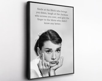 May include: A black and white framed wall art print featuring a portrait of a person with an updo hairstyle and a hair accessory. The person is making a middle finger gesture. The text reads: Smile at the Bitch who brings you down, laugh at the Jackass who screws you over, and give the finger to the Idiots who didn't know any better.