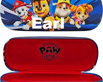 May include: A blue hard-shell glasses case featuring Paw Patrol characters Marshall, Chase, Rubble, and Skye on the exterior with the name Earl printed in white. The interior is lined with red fabric and displays the black Paw Patrol logo.