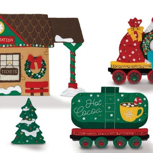 May include: Felt Christmas train set with a train station, a hot cocoa car, and a polar bear pulling a wreath and a gift bag.