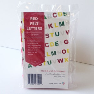 May include: A package of 60 red felt letters, each measuring 7/8 inch. The letters are arranged in alphabetical order on the packaging. The packaging also includes the company name "MerryStockings" and their website address. Made in the USA.