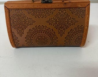 Women's Brown leather vintage clutch bag with a touch of boho