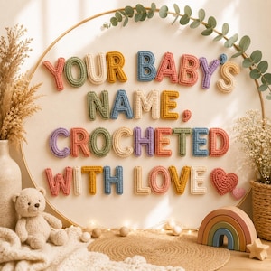 May include: A circular wall hanging featuring individual crocheted letters in various colors spelling out the text "YOUR BABY'S NAME, CROCHETED WITH LOVE" with a small crocheted heart, mounted on a light-colored fabric background within a wooden hoop.