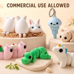 May include: A collection of whimsical, colorful figurines, including a white bunny, a green articulated alligator, and a blue jellyfish keychain. The text "COMMERCIAL USE ALLOWED" is at the top. The figurines are displayed on small, round platforms.