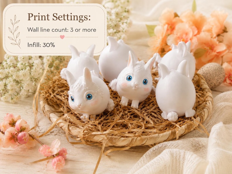May include: A collection of white bunny figurines with blue eyes and pink accents, arranged in a woven basket filled with straw. The image includes text that says "Print Settings: Wall line count: 3 or more, Infill: 30%."
