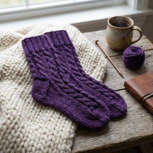 May include: A pair of deep purple hand-knitted socks featuring a vertical cable knit pattern and ribbed cuffs. The socks are crafted with a textured stitch design, showcasing a consistent cable motif that runs from the cuff down to the toe area.