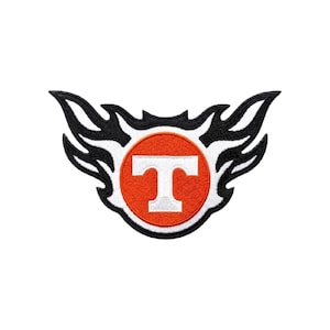 May include: Embroidered patch featuring a stylized orange circle with a white "T" inside, surrounded by a black and white flame design. The patch is likely for apparel or accessories, showcasing a team or brand logo.