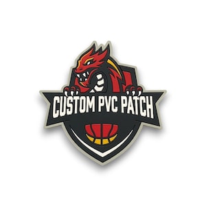 May include: A custom PVC patch featuring a red and black dragon design with yellow accents. The patch is in the shape of a shield with a basketball graphic at the bottom. The text "CUSTOM PVC PATCH" is displayed in white.