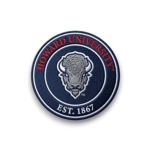 May include: A circular patch with the Howard University emblem. The patch has a navy blue background with red text and border. The logo features a bison head and the words "HOWARD UNIVERSITY" and "EST. 1867".