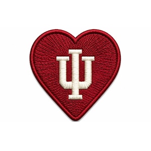 May include: A heart-shaped patch with a red embroidered background. The patch features a cream-colored design of the letters "IU" in the center. The patch is likely for apparel or accessories.
