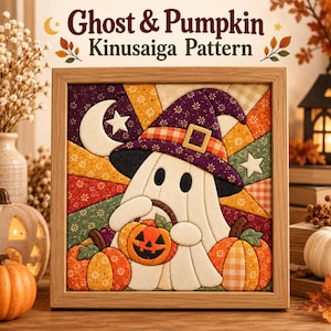 May include: A framed Kinusaiga fabric art piece featuring a white ghost wearing a purple witch hat, holding a small jack-o'-lantern, flanked by two pumpkins. The background displays a sunburst pattern in autumn colors with a crescent moon and stars.