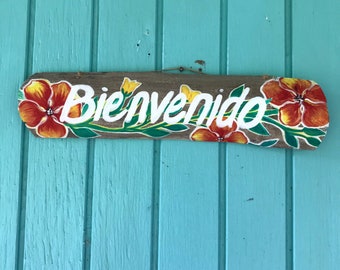 Bienvenido Hand Painted on driftwood, with red hibiscus, tropical flowers, indoor outdoor sign, 15 x 4 inches