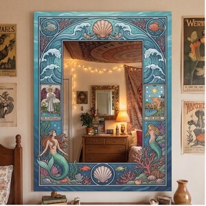 May include: A large rectangular mirror with a decorative border featuring mermaids, seashells, and ocean waves. The mirror's design incorporates tarot card imagery, including "The Temperance" and "The Star" cards, with a color palette of blues, greens, and pinks.