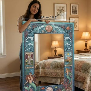 May include: A large, rectangular mirror with a blue and teal mermaid and ocean-themed design. The mirror is 31.5 inches wide and features illustrations of mermaids, seashells, and tarot card imagery. The frame has a wave pattern.