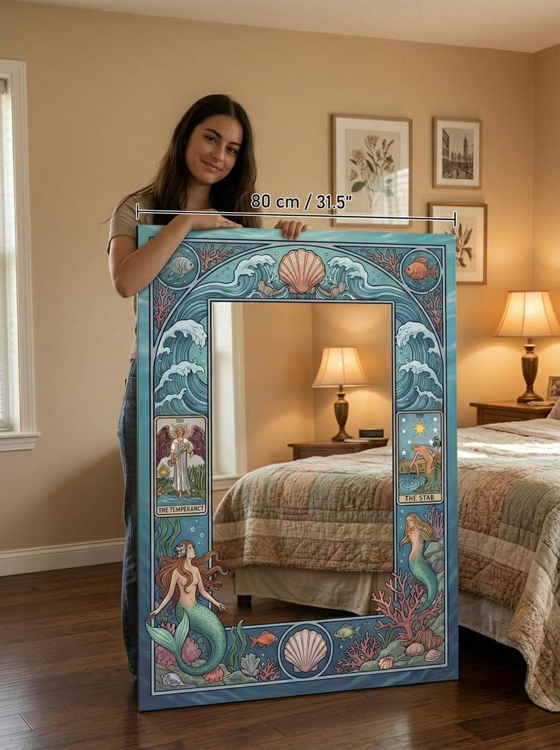 May include: A large, rectangular mirror with a blue and teal mermaid and ocean-themed design. The mirror is 31.5 inches wide and features illustrations of mermaids, seashells, and tarot card imagery. The frame has a wave pattern.