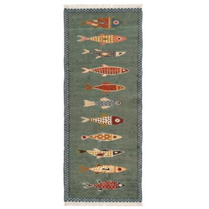 May include: A rectangular, teal-colored rug with a repeating pattern of colorful fish. Each fish is uniquely designed with various patterns and colors, including red, orange, yellow, and blue. The rug has a fringed edge and a border with a geometric design.