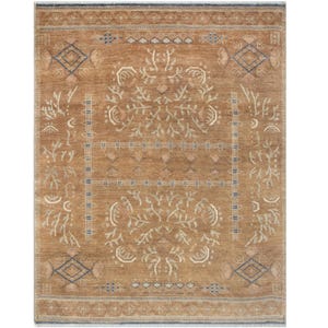 May include: A rectangular area rug featuring a warm tan background with intricate cream and blue geometric and floral patterns. The design includes symmetrical tree-like motifs, diamond shapes, and linear borders with fringe at the top and bottom.