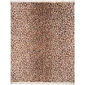 May include: A rectangular area rug featuring a repeating dark brown leopard print pattern on a light cream background. The rug is finished with short, light-colored fringe detailing along the top and bottom edges, providing a textured border.