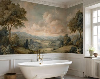 May include: A white clawfoot bathtub with gold fixtures is set against a wall mural depicting a landscape scene with trees, hills, and a cloudy sky. The bathroom features white wainscoting and a window with natural light.