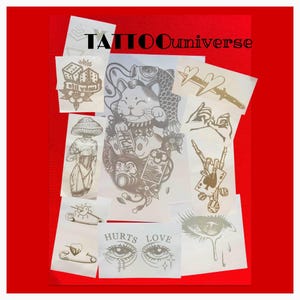 May include: A collection of tattoo designs on translucent paper, including dice, a cat with a fish, a mushroom figure, and the text "HURTS LOVE." The designs are in shades of gray and brown, set against a red background, with the text "TATTOOuniverse" at the top.
