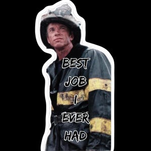 May include: A sticker showing a firefighter in uniform, with the text "BEST JOB I EVER HAD". The firefighter wears a helmet and a jacket with yellow stripes. The background is black.