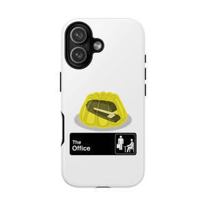May include: White phone case with a yellow jelly dessert and a stapler inside. Below the dessert is a black rectangle with the text "The Office" and a stick figure icon.